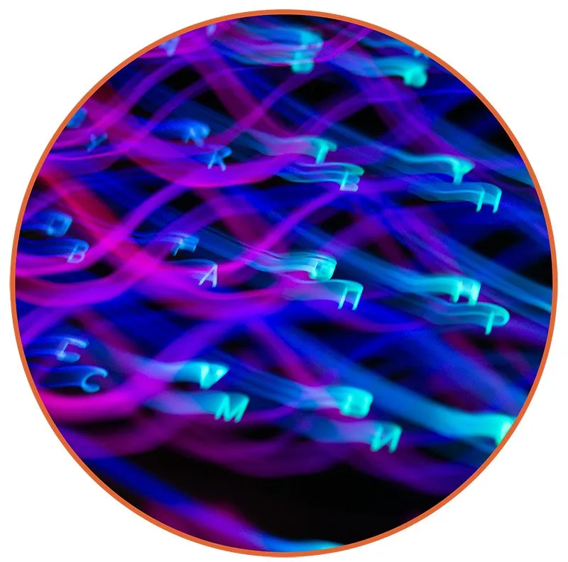 642 Blurred neon letters on a dark background with swirling blue and pink light trails, creating a dynamic, futuristic, and abstract mood.
