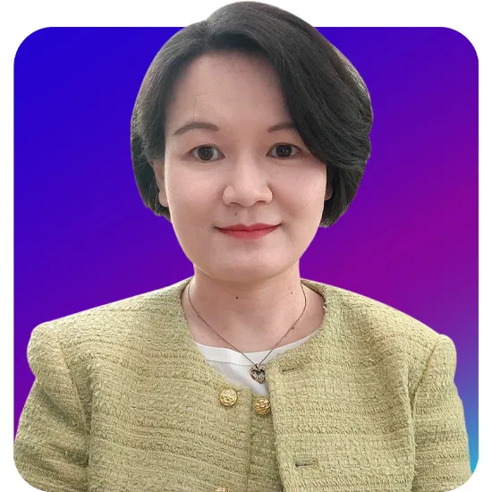 A person with short dark hair wearing a green blazer smiles slightly against a vibrant gradient background of purple and blue, conveying professionalism.